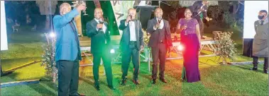  ?? ?? Transport minister Felix Mhona (second from left) and other guests toast to the Airports Company of Zimbabwe launch