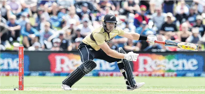  ?? PHOTO: PETER MCINTOSH ?? Back in stride . . . Opener Martin Guptill plays an ungainly shot on his way to topscoring with 97, laying the foundation­s for the Black Caps’ thrilling fourrun win in the second T20 against Australia at the University of Otago Oval yesterday.