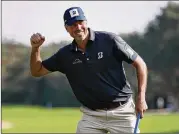  ?? ROB CARR / GETTY IMAGES ?? Matt Kuchar celebrates his win Sunday in the Mayakoba Golf Classic in Playa del Carmen, Mexico, for his first PGA Tour title since 2014.