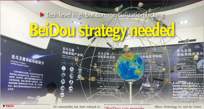 ?? Photo: Ma Jingjing/GT ?? A man looks at a model of the BeiDou Satellite Navigation System in Gu’an, North China’s Hebei Province on Tuesday.
