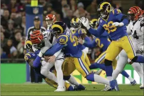  ?? THE ASSOCIATED PRESS ?? In this Oct. 27, 2019, file photo, Cincinnati Bengals quarterbac­k Andy Dalton (14) is sacked by Los Angeles Rams defensive end Michael Brockers (90) and defensive end Dante Fowler