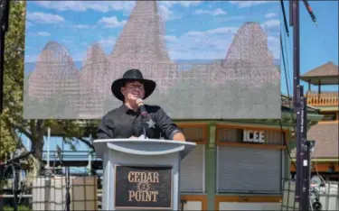  ?? ERIC BONZAR—THE MORNING JOURNAL FILE ?? Jason McClure, Cedar Point vice president and general manager, announces Cedar Point’s new hyper-hybrid coaster “Steel Vengeance,” during the amusement park’s Frontier Town Hootenanny! event, Aug. 16, 2017. The coaster is slated to open for the 2018...