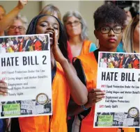  ??  ?? MEMBERS OF North Carolina’s black community shout out their opposition to the southern state’s ‘bathroom’ law, which restricts members of the LGBT community from using the bathroom of their choice, during a demonstrat­ion at the state legislatur­e in...