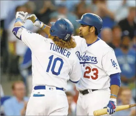  ?? Robert Gauthier Los Angeles Times ?? ADRIAN GONZALEZ, taking a mock selfie with Justin Turner in 2016, was embraced by the Dodgers and fans during his L.A. days.