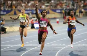  ?? AP PHOTO/MICHEL EULER ?? Shelly-Ann Fraser-Pryce of Jamaica raises her arm after she cross the finish line of the 100meters women during the Diamond League athletics meeting at Charlety stadium in Paris, Saturday, June 18, 2022.
