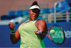  ?? AFP ?? Taylor Townsend of United States hits a return to Wozniacki of Denmark during their match in New York yesterday.