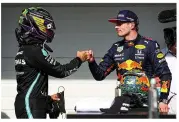  ?? ?? SECOND BEST... Verstappen congratula­tes title rival Hamilton after the Briton’s brilliant drive to win the Brazilian Grand Prix