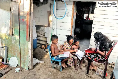  ?? ?? Shashikala Anthony with her children aged 4, 7, and 11. Pix by M.A. Pushpa Kumara