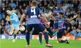  ?? Photograph: Tom Flathers/Manchester City FC/Getty Images ?? Jack Grealish scores Manchester City fourth goal in their 6-3 victory against RB Leipzig at the Etihad Stadium.