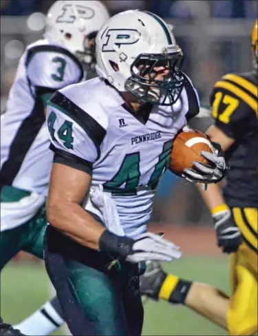  ??  ?? Pennridge’s Kenny Crawford(44)takes off past Central Bucks West defenders for a touchdown during first half action of their contest at Central Bucks West High School on Friday September 28,2012.(photo by Mark C Psoras)