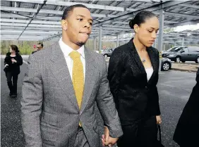  ?? MEL EVANS/The Associated Press files ?? Baltimore Ravens football player Ray Rice holds hands with his wife, Janay Rice, as they arrive at Atlantic County Criminal Courthouse in May. After newly released video of an elevator altercatio­n showed Rice punching his then fiancee in the head, he...