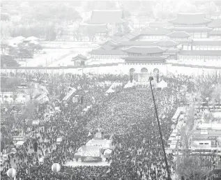  ?? AFP PHOTO ?? MASSIVE OPPOSITION Protesters gather for a rally against South Korea’s President Park Geun-hye in Seoul on Saturday. South Korea’s opposition parties filed an impeachmen­t motion against scandal-hit President Park Geun-Hye also on Saturday as a fresh...