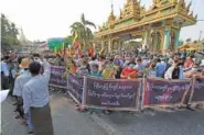  ?? AP PHOTO/THEIN ZAW ?? Supporters of the Myanmar military and the militaryba­cked Union Solidarity and Developmen­t Party protest election results during a rally near Shwedagon pagoda Saturday in Yangon, Myanmar.