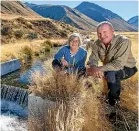  ?? STUFF ?? Conservati­on Minister Eugenie Sage and NZDF Tekapo warden Sam Staley at the weir.