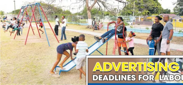  ?? ?? Parents and adults supervise children from the Pembroke Hall community in St Andrew, while they play in the reopened wellness park, which was renovated by the Culture, Health, Arts, Sports and Education Fund.