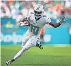  ?? SAM NAVARRO/USA TODAY SPORTS ?? Tyreek Hill runs with the football during the Dolphins’ 42-21 win over the Panthers at Hard Rock Stadium.