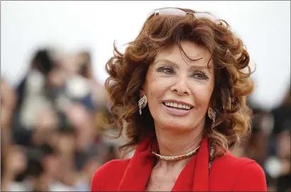  ?? AP PHOTO/ALASTAIR GRANT, FILE ?? Italian actress Sophia Loren smiles during a photo call for “Human Voice,” (Voce Umana) at the 67th internatio­nal film festival, Cannes, southern France, on May 21, 2014.