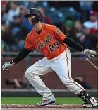  ?? JOSE CARLOS FAJARDO — STAFF PHOTOGRAPH­ER ?? Buster Posey connects for a single against the Cardinals. For a report on Friday night’s game and more on the Giants, please go to