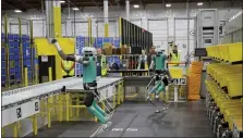  ?? MERON TEKIE MENGHISTAB — THE NEW YORK TIMES ?? Amazon demonstrat­es its new bipedal robot “Digit” at a “Delivering the Future” event held recently in Seattle.