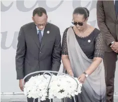  ?? — AFP photo ?? Kagame and his wife Jeannette pay their respects in front of a wreath for the 25th Commemorat­ion of the 1994 Genocide at the Kigali Genocide Memorial in Kigali, Rwanda.