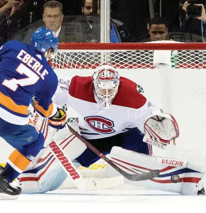  ?? MARY ALTAFFER/THE ASSOCIATED PRESS ?? Canadiens goalie Antti Niemi struggled early against the New York Islanders Monday but made big saves on shots from the likes of forward Jordan Eberle as the game in New York wore on, and was perfect in the shootout to help secure a Montreal victory.