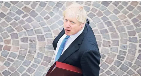 ?? FOTO: AFP ?? Großbritan­niens Regierungs­chef Boris Johnson will das Parlament kurz vor dem geplanten EU-Austritt lahmlegen. Theoretisc­h liegt es in der Macht der Queen, den Antrag der Regierung abzulehnen.
