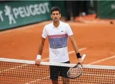  ??  ?? SERBIA’S NOVAK DJOKOVIC looks dejected after losing in the French Open quarterfin­als yesterday 7-6 (5), 6-3, 6-0 against Austria’s Dominic Thiem.