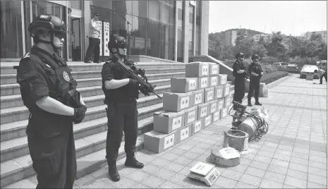  ?? Photo: VCG ?? Qingdao police in Shandong Province destroy more than 300 kilograms of narcotics worth more than 50 million yuan ($7.05 million) on Friday.