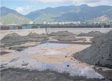  ??  ?? BROKEN VOWS: Mounds of dirt in what was once a warm-up pool for the Summer Olympics. Rio has quickly become the latest, and perhaps most striking, case of unfulfille­d promises and abandonmen­t.