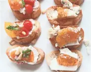  ??  ?? Tomato Crostini with Whipped Feta (left) and Blue Cheese and Fig Crostini make a pretty appetizer tray.