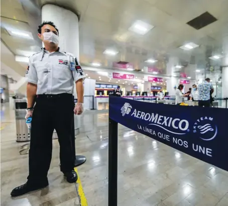  ?? Reuters/File ?? A security guard stands guard at the Benito Juarez Internatio­nal Airport, amid the outbreak of coronaviru­s disease in Mexico City.