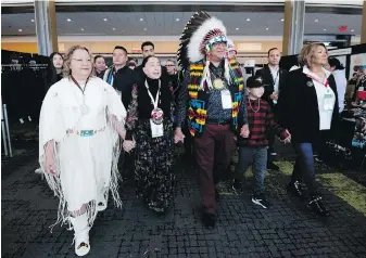  ?? THE CANADIAN PRESS ?? Cindy Woodhouse, left, with interim national chief Joanna Bernard, second left, and David Pratt, centre, during the third day of the Special Chiefs Assembly in Ottawa on Thursday.