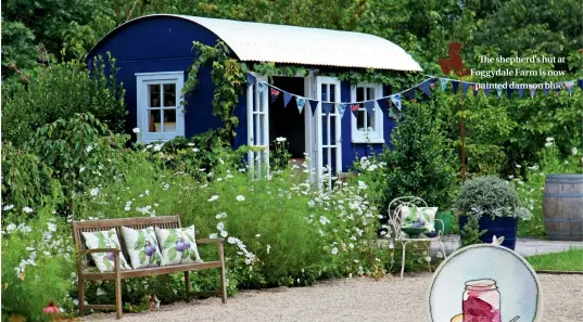  ??  ?? The shepherd's hut at Foggydale Farm is now painted damson blue.