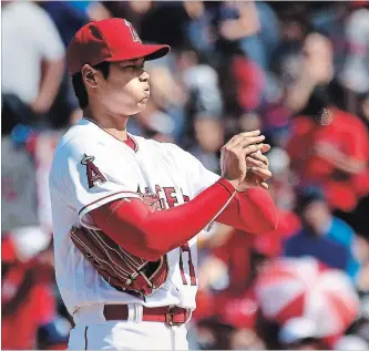  ?? WALLY SKALIJ TNS ?? Angels pitcher Shoehei Ohtani reacts after giving up a single against the A’s to break up the perfect game in the 7th inning at Anaheim Stadium Sunday, April 8, in Anaheim, Calif.