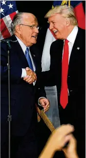  ?? JEFF SINER/CHARLOTTE OBSERVER ?? Former New York mayor Rudy Giuliani welcomes thenpresid­ential candidate Donald Trump on stage during a campaign rally in August 2016. Giuliani says he has joined Trump’s legal team.