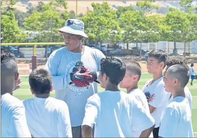  ?? PHOTO BY PIERRE WHITSEY ?? Houston Texans tight end Stephen Anderson, who played at Cal, talks to kids during his inaugural Elevate Our Youth Foundation Football Camp held at his alma mater of Piedmont Hills in San Jose.