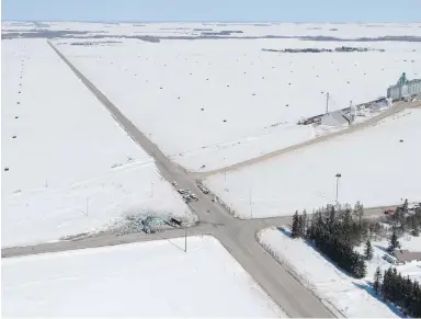  ??  ?? An aerial view of the wreckage of a fatal crash outside Tisdale, Sask., is seen on Saturday, the day after a bus carrying the Humboldt Broncos hockey team collided with a tractor-trailer.