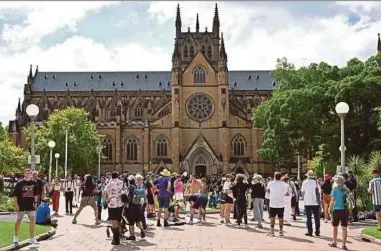  ?? AFP PIC ?? Protesters gathering in front of St Mary’s Cathedral during the funeral of late Australian Catholic Cardinal George Pell in Sydney yesterday.