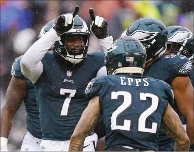  ?? MATT SLOCUM — THE ASSOCIATED PRESS ?? Eagles linebacker Haason Reddick, left, celebrates after recovering a fumble by Jacksonvil­le Jaguars quarterbac­k Trevor Lawrence during the second half Sunday at Lincoln Financial Field.