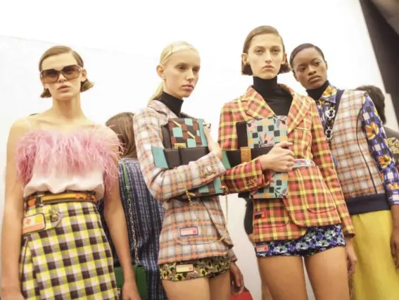  ??  ?? There were deco-graphic prints, geometric shapes and gingham at Prada