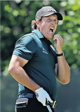  ??  ?? Boiling over: Phil Mickelson’s frustratio­ns got the better of him on 13 (below)