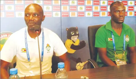  ??  ?? CALM BEFORE THE STORM . . . Zimbabwe coach Callisto Pasuwa (left) addresses the media in Francevill­e yesterday in the company of Warriors’ vice captain Cuthbert Malajila ahead of tonight’s Nations Cup showdown against Senegal