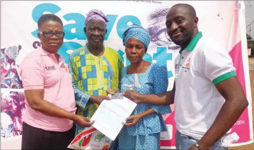  ??  ?? L-R-CMD, Medicure Healthcare Ltd, Dr. Bolaji Akinrimins­i, beneficiar­ies, Mr. Samuel Olalere Ojo, Mrs. Comfort Ajose with Dr. Megbuwawon at the presentati­on of Project Gray Access Card at the event