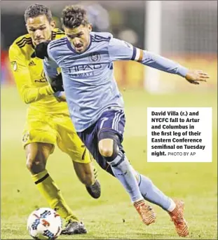  ?? PHOTO BY AP ?? David Villa (r.) and NYCFC fall to Artur and Columbus in the first leg of their Eastern Conference semifinal on Tuesday night.