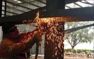  ?? ALEXANDER PANETTA, THE CANADIAN PRESS ?? A worker welds steel beams for the latest expansion of a plant in San Juan Del Rio, Mexico, owned by Canadian auto parts company Exo-S.