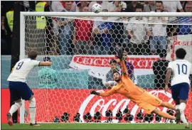  ?? ?? Harry Kane thumps his penalty over the bar during the defeat to France