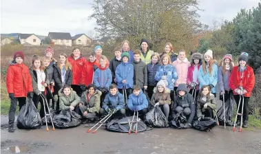  ??  ?? Team work Around 200 pupils from schools in Blairgowri­e and Rattray took part in a mass litter pick in the town in November, supported by volunteers from the Blairgowri­e and Rattray Access Network and Blair in Bloom