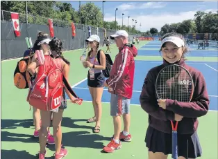  ?? BRENDAN MCCARTHY/THE TELEGRAM ?? Newfoundla­nd and Labrador tennis player Ashley Stringer poses for a photo at the Winnipeg Lawn Tennis Club, while her Canada Games teammates, Emma Murray, Olivia Casey and Jasmine Rahman, talk with coach Mike Meaney prior a Sunday practice session....