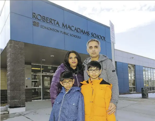  ?? LARRY WONG ?? Sushma, rear left, and Daxesh Dalal and their sons Krishan, 9, and Jayden, 11, stand outside Roberta MacAdams School in southwest Edmonton where the boys attend school. The family is concerned the rapidly growing area of the city was not promised a new...