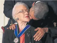  ?? Alex Wong, Getty Images file ?? President Barack Obama kisses Johnson after he presented her in 2015 with the Presidenti­al Medal of Freedom during a ceremony at the White House.